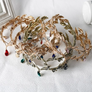 Elegant bridal leaf crown set with colorful teardrop crystals in gold and silver finish