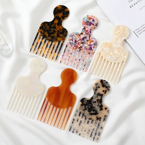 Macro view of six diverse marble and tortoiseshell patterns on acetate hair combs