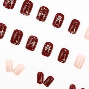 Winter press-on nails with red snowflakes and pink gold glitter in short square shape