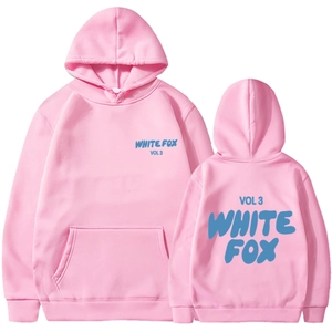 Detail of pink hoodie with blue WHITE FOX VOL 3 text on soft cotton fabric surface