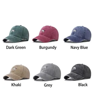 Washed cotton baseball caps with dog embroidery available in six classic vintage colors