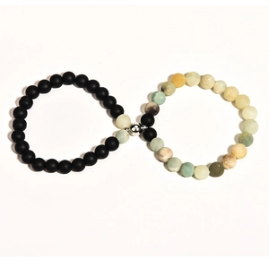 Detail of magnetic couple bracelets featuring matte black onyx and colorful natural stones