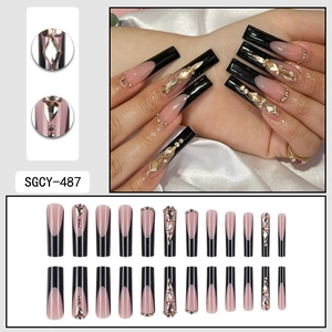 Faux ongles longs forme cercueil style français noir avec strass 3D brillants