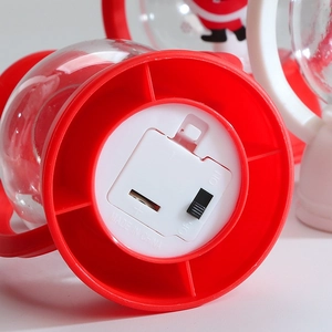 Detailed close-up of the battery compartment and power switch for Christmas LED ornaments
