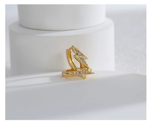Detailed view of gold lightning bolt earrings with shimmering pavé zircon stones