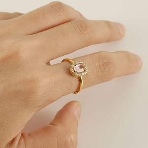 18K gold plated oval pink zircon ring with white diamonds on female hand