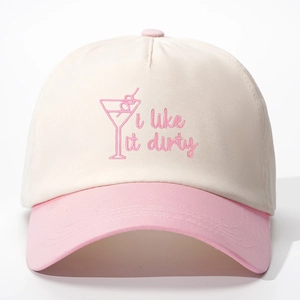 Detail of pink Martini embroidery and 'I like it dirty' text on two-tone baseball cap
