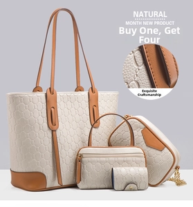 Detail of 4-piece tote set showing chain strap and embossed leather texture