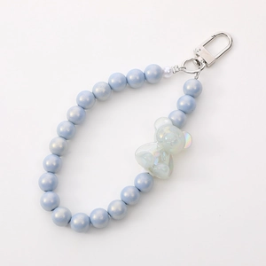 Light blue beaded keychain with iridescent bear pendant and silver metal clasp