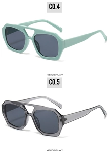 Vue latérale à 45 degrés de lunettes de soleil à double pont en vert menthe et gris