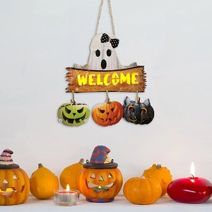 Halloween Welcome sign with LED pumpkin and ghost hanging on a white wall decor
