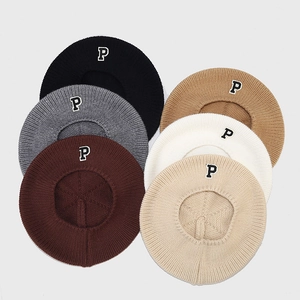 Close-up of knit beret hats in six colors with P letter embroidery for autumn and winter