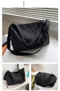 Detailed view of black waterproof oxford fabric sports bag with smooth dual zippers