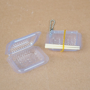 Miniature dollhouse food container keychain with open lid and tiny chopsticks