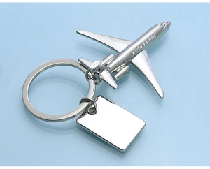 Detailed top-down view of a shiny silver airplane keychain with zinc alloy metal finish