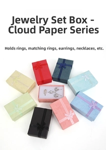 Top view of jewelry gift boxes with cloud texture and bows in diverse colors with foam pads