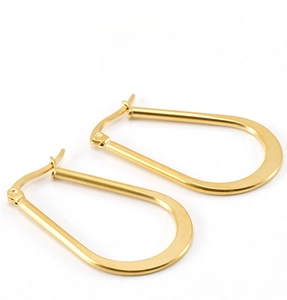 Detailed view of golden teardrop hoop earrings featuring a secure snap closure design