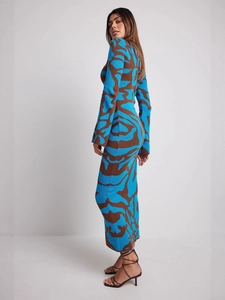 Slim fit knit maxi dress with vibrant blue and brown abstract leopard print patterns