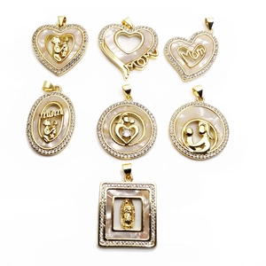 Gold MOM heart pendant necklace with shell inlay and cubic zirconia on white background