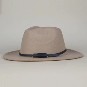 Detail of wool felt fedora hat featuring a camel texture and dark belt with metal buckle