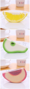 Detailed view of 3D fruit-shaped sticky notes featuring realistic lemon and watermelon slices