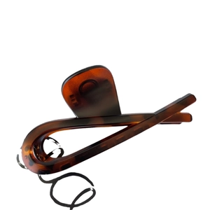 Classic large tortoiseshell claw clip with amber texture for thick hair styling