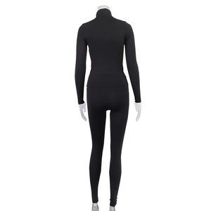 Rear view of black high-elastic fitness set featuring zip-up jacket and leggings on mannequin