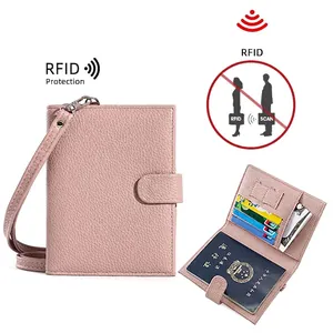 Pink genuine leather passport holder with RFID blocking and detachable shoulder strap