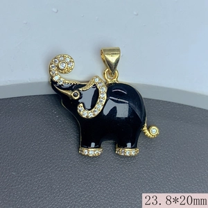 Macro detail of black enamel elephant pendant with gold trim and crystal accents 23.8x20mm