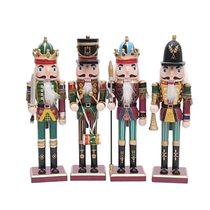 Set of four traditional wooden Christmas nutcracker figures on a clean white background