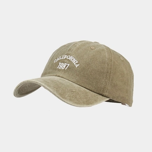 Detail shot of vintage washed khaki baseball cap with white CALIFORNIA 1987 embroidery