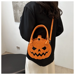 Detail of pumpkin-shaped handbag with spider web stitching and detachable shoulder strap