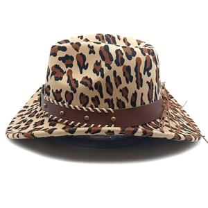 Detail of leopard print western cowboy hat featuring leather strap and metal studs