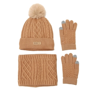 Detail of camel cable knit winter set featuring faux fur pom and touch screen gloves