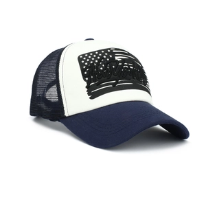 Close-up of the New York embroidery and US flag print on the blue trucker cap mesh