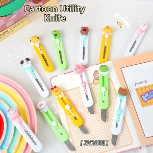 Close-up of cute cartoon portable utility knives with animal heads and retractable blades