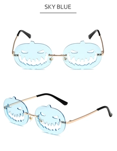 Detail view of sky blue pumpkin sunglasses with hollow metal frame for Halloween outfits