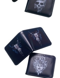 Detail view of men's skull pattern wallets showing smooth material and zip closure