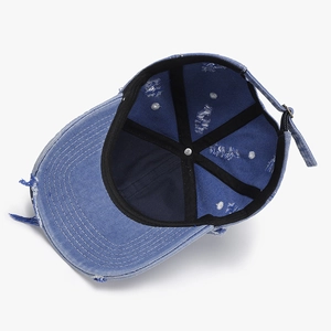 Internal view of light blue distressed denim baseball cap with reinforced seams and stitching