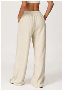 Rear view of high-waist light beige wide-leg sweatpants with elastic waistband