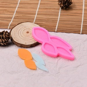 Pink silicone mold for baking leaf shaped chocolates and cakes with leaf vein textures