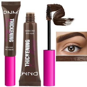 Thickening fiber brow mascara in dark brown with brush applicator and result closeup