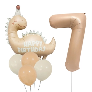 Detail of matte cream dinosaur and number 7 balloon set for 7th birthday party decor