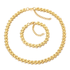 Golden woven link jewelry set featuring a matching necklace and bracelet on white background