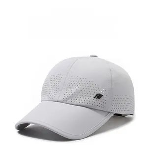 Detail of laser-cut perforated fabric for enhanced breathability on light grey baseball cap