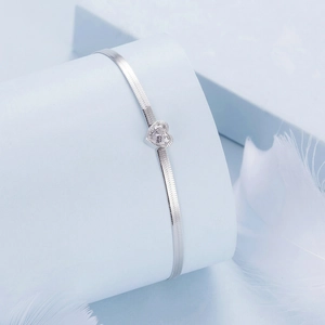 Elegant S925 sterling silver heart zircon herringbone chain bracelet on white feathers
