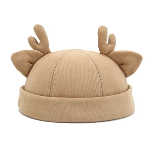 Minimalist khaki docker hat with reindeer ears and antlers decor on white background