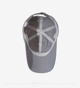Detail showing inner 6-panel structure and metal buckle of the grey quick-dry baseball cap