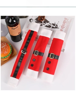 Detailed view of three Santa suit themed refrigerator handle covers with belt and gold buckle