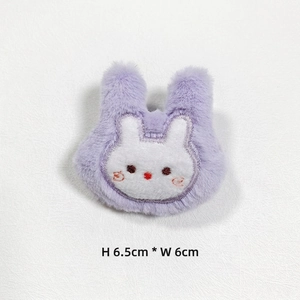 Detail view of plush purple bunny patch with embroidery, sized 6.5cm height and 6cm width